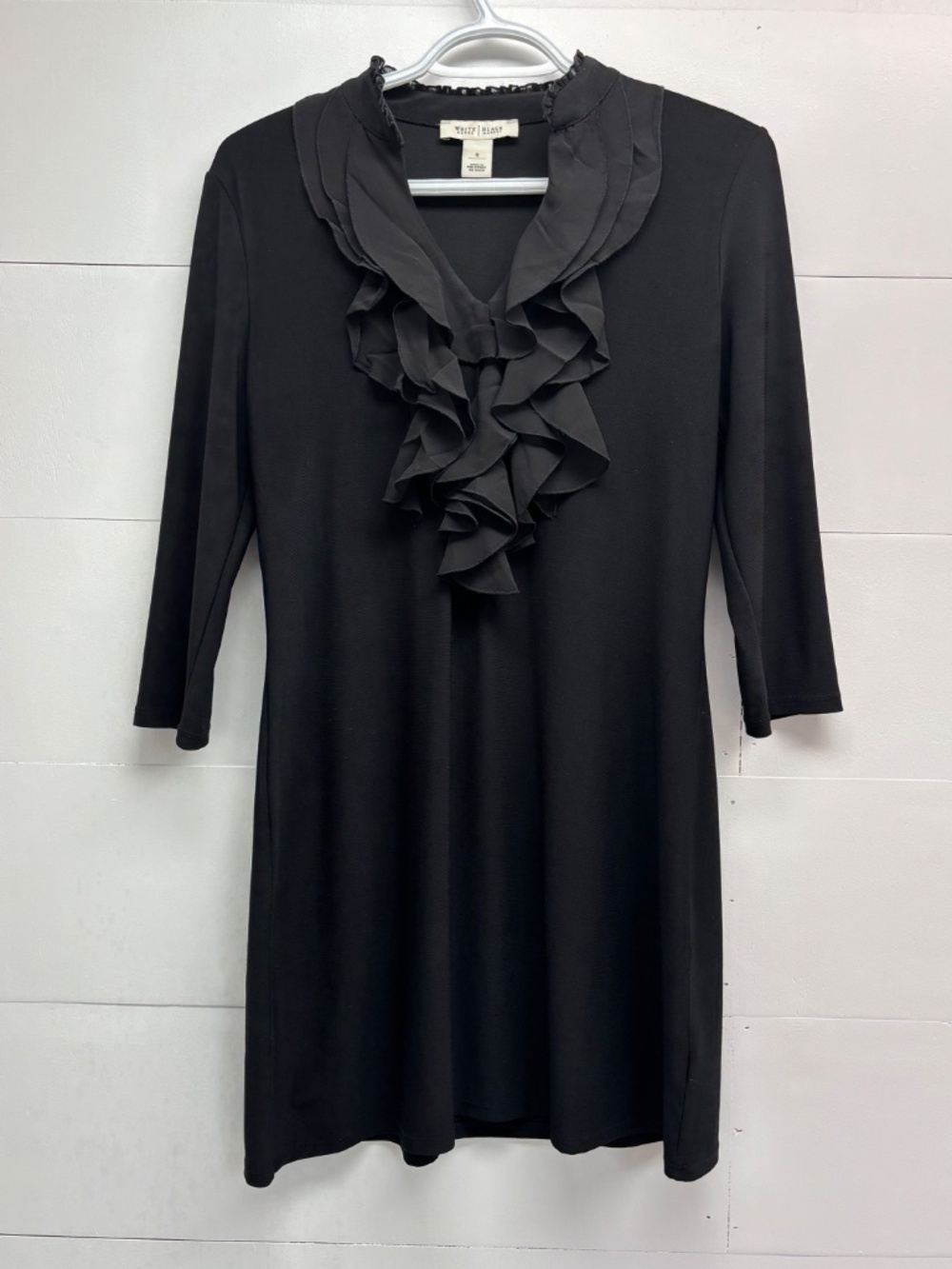 White House Black Market mini dress with ruffled v-neckline and 3/4 sleeves